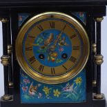 A French ebonised mantel clock with brass mounts, height 11"