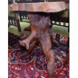 A large root carving in the form of a garden table, H88cm