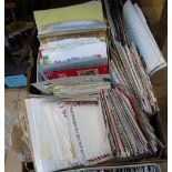 A box of stamped envelopes etc