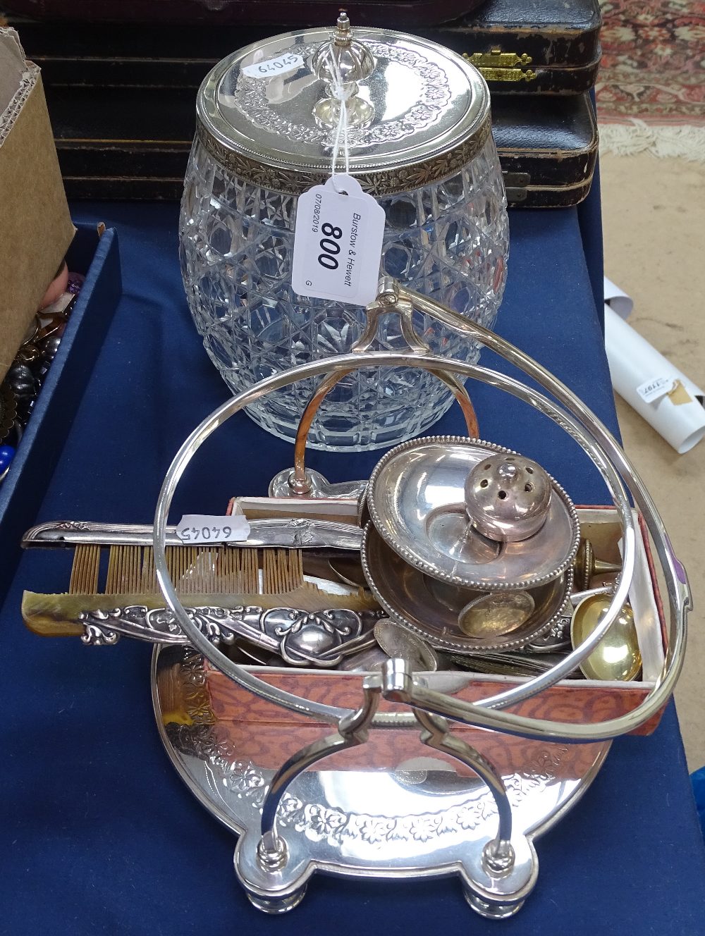 A cut-glass silver-mounted biscuit barrel, a silver-mounted comb, a plated stand etc