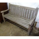 A weathered teak slatted garden bench, L151cm