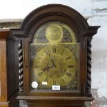 A panelled oak-cased clock, with brass arch-top dial and 3-train movement, H190cm