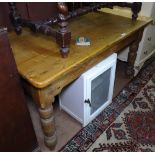 A pine plank-top kitchen table, with single frieze drawer, raised on baluster turned legs, L138cm,