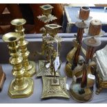 A pair of New Zealand Forces trench art candlesticks, 11.25", a pair of brass figure candlesticks,