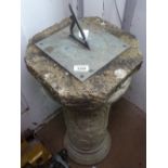 A weathered concrete sundial on circular column, H75cm