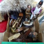 A wolf's pelt, aviator figures, leather belts, cannon etc