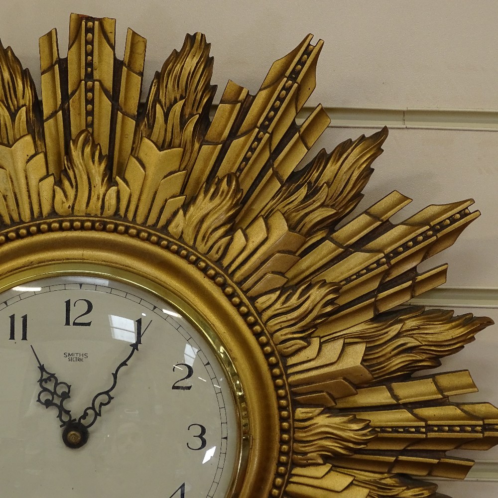 A Smiths sunburst wall clock