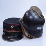 A Vintage Swiss cap and a Continental military helmet