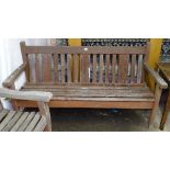 A weathered teak slatted garden bench, L158cm