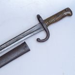 A 19th century French sword bayonet with brass handle, original metal scabbard, overall length 71cm