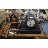 An oak-cased wall clock, a miniature longcase clock, and an ebonised mantel clock