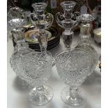 A pair of cut-glass decanters and stoppers with silver collars, 7.75", candlesticks, and a pair of