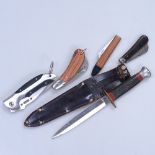 Black Eagle knife in sheath, and 4 pocket knives