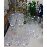 3 decanters, 2 glass jugs, and crystal drinking glasses