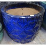 A large blue glazed terracotta garden planter, H45cm, W54cm