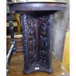 An Indian carved hardwood circular table, with engraved brass top, 51cm