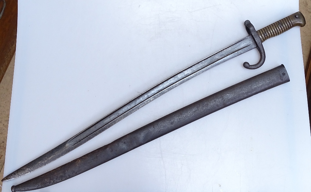 A 19th century French sword bayonet with brass handle, original metal scabbard, overall length 71cm - Image 2 of 2