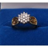 A 9ct gold diamond cluster flowerhead design ring