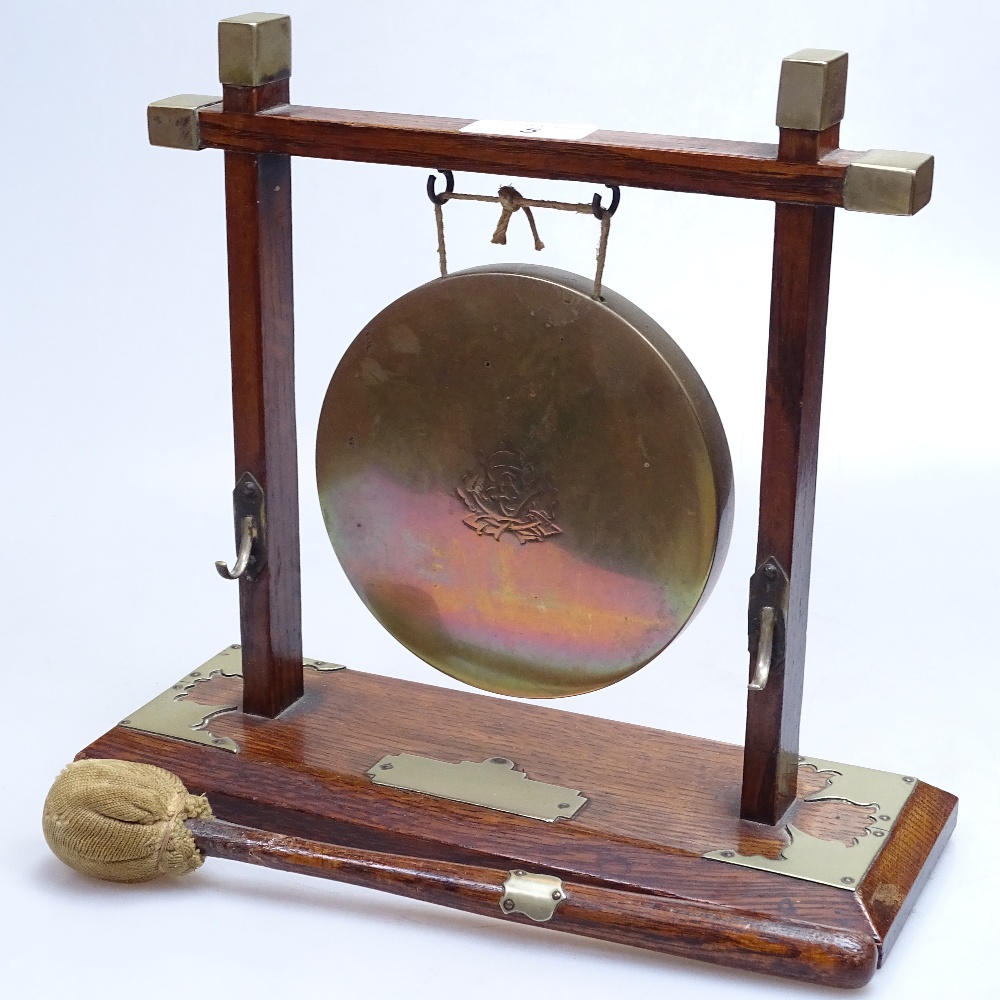 An Arts and Crafts oak brass gong with striker, height 10" - Image 2 of 2