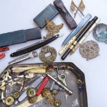 A razor, buttons and badges, including military etc