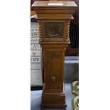 A longcase clock, 15.25"