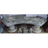 A weathered concrete garden bench, L140cm