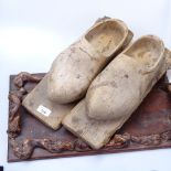 A carved wood tray with rootwood decoration, and a pair of Clog snow skis