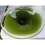 A 14" diameter Wedgwood fruit bowl in bottle green glass