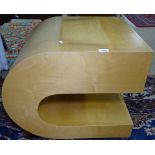 A modernist bent ply C-shape coffee table with shelf, H52cm