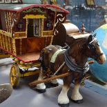 A painted wood gypsy caravan and horse, length 88cm overall