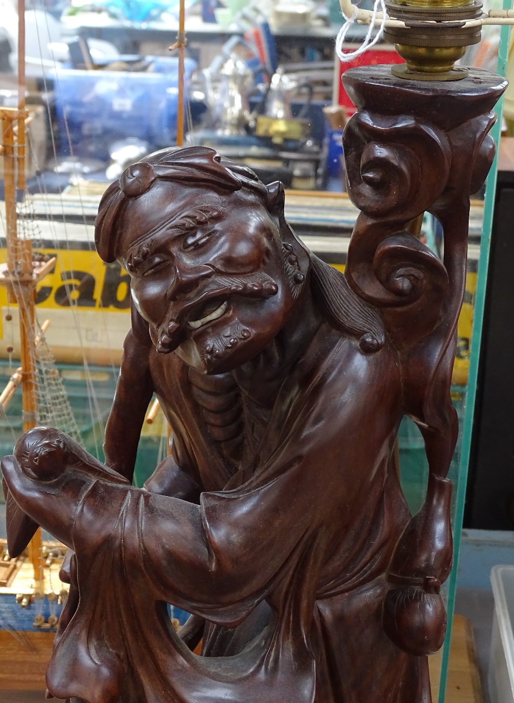 An Eastern carved hardwood figure table lamp, base height 43cm