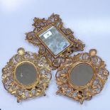 A pair of cast and pierced gilt-metal oval strut frames, and a similar rectangular frame, height