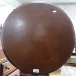 A 19th century mahogany circular tilt-top table, on tripod base