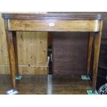 A Regency mahogany foldover tea table, raised on ebony-strung square tapered legs, W92cm