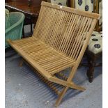 A teak slatted folding garden bench, L100cm