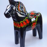 A Swedish painted wood horse, height 39cm, by Nils Olsson
