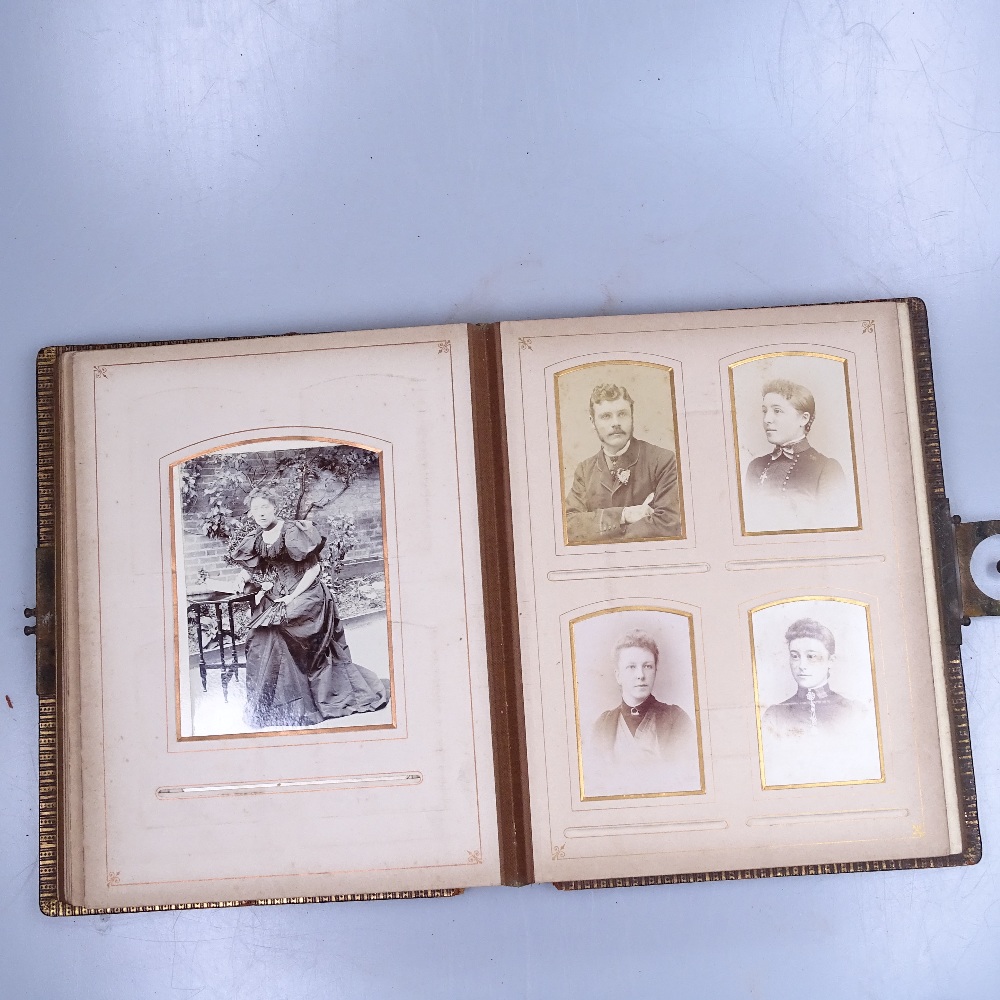 A Victorian family photograph album, a small Continental clock, and a larger Continental pillar - Image 2 of 2