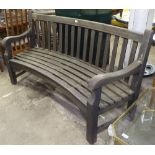 A concave teak slatted garden bench, L175cm