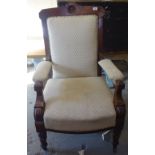 A Victorian upholstered and walnut-framed open armchair