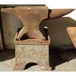 An extremely heavy cast-iron forge anvil, on stand, H74cm, L84cm