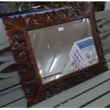 A French bevelled-edge wall mirror, in pierce carved oak frame, W80cm, H63cm