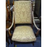 A stained beech and upholstered folding campaign chair