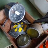 Tinted goggles, an AA badge, a Smiths car clock