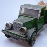 A Vintage painted wood toy tipper-truck with a load of bricks, length 47cm