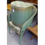 A green Lloyd Loom laundry bin and matching bedroom chair