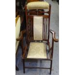 An Edwardian stained beech folding armchair