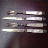 A set of 4 silver and mother-of-pearl fruit knives and forks
