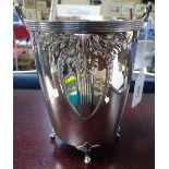 A WMF electroplate ice bucket, with relief-moulded sides and glass liner, height excluding handle