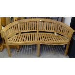 A teak banana garden bench