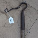A 19th century wrought-iron and wood shepherd's crook, height 138cm